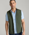 Model is wearing UNTUCKit Inman performance vest in green.