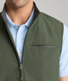 Model is wearing UNTUCKit Inman performance vest in green.