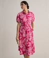 Model is wearing UNTUCKit Cotton Stretch Pink Jackie Midi Shirtdress with Belt. 