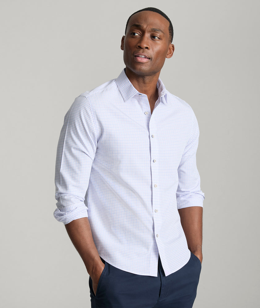 Model is wearing UNTUCKit Jeffries wrinkle-free shirt in purple. 