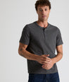 Model is wearing UNTUCKit Jericho henley in gray.