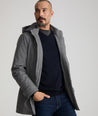 Model is wearing UNTUCKit Jimenez insulated jacket in gray.