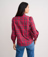 Model is wearing UNTUCKit Joy shirt in red plaid. 