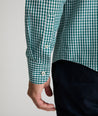 Model is wearing UNTUCKit Lawerence in dark green gingham. 