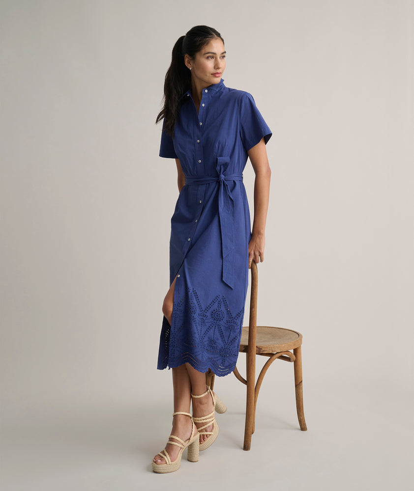 Model is wearing UNTUCKit Cotton Stretch Navy Eyelet Lillian Midi Shirtdress.