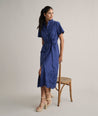 Model is wearing UNTUCKit Cotton Stretch Navy Eyelet Lillian Midi Shirtdress.