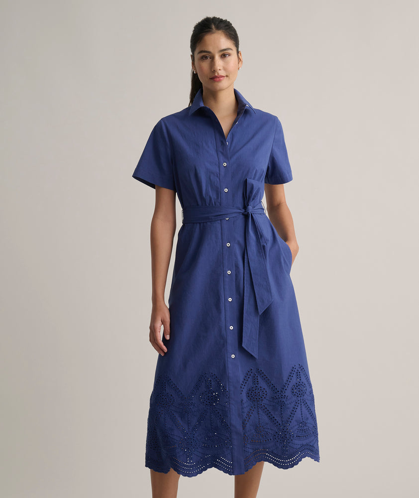 Model is wearing UNTUCKit Cotton Stretch Navy Eyelet Lillian Midi Shirtdress.