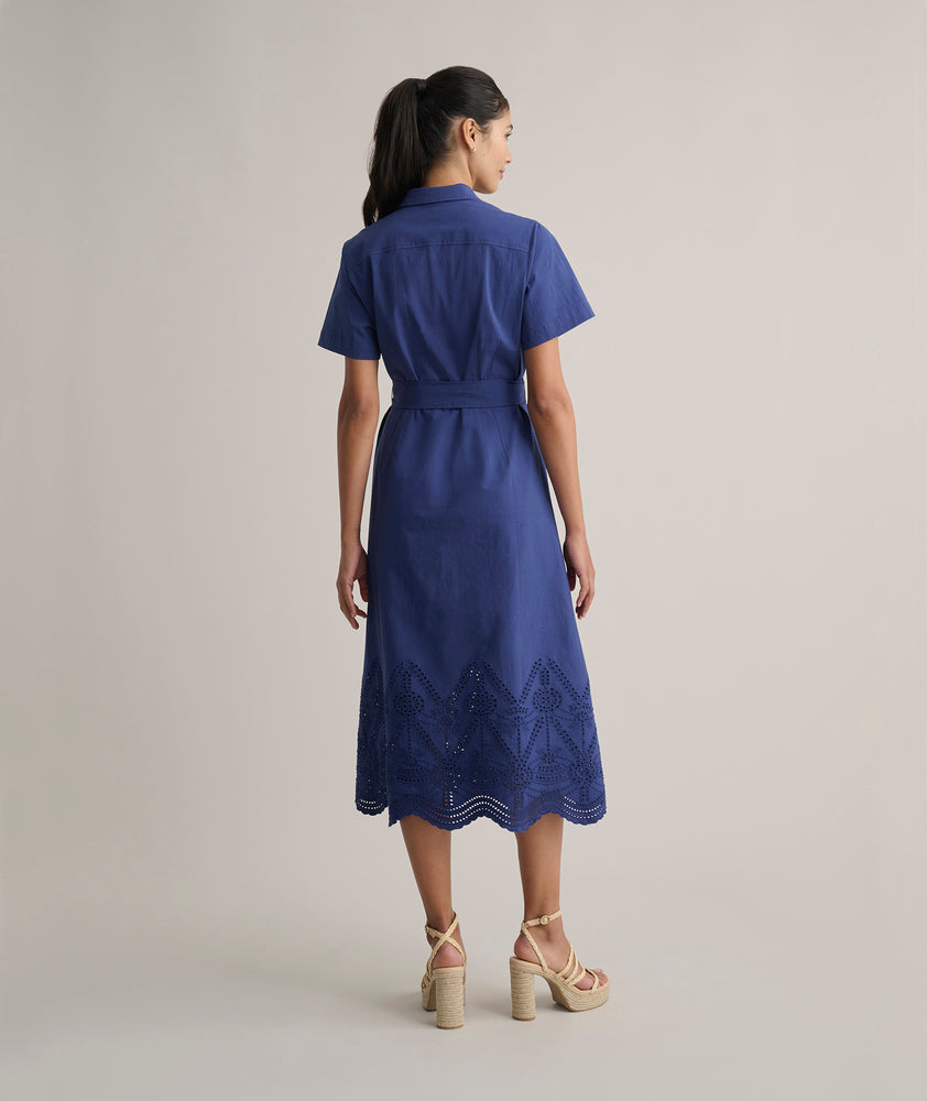 Model is wearing UNTUCKit Cotton Stretch Navy Eyelet Lillian Midi Shirtdress.