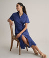 Model is wearing UNTUCKit Cotton Stretch Navy Eyelet Lillian Midi Shirtdress.