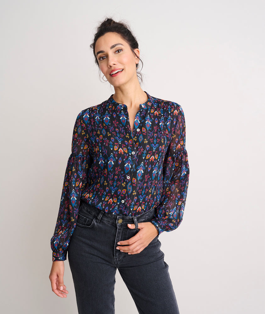 Model is wearing UNTUCKit printed black Lorelei shirt.