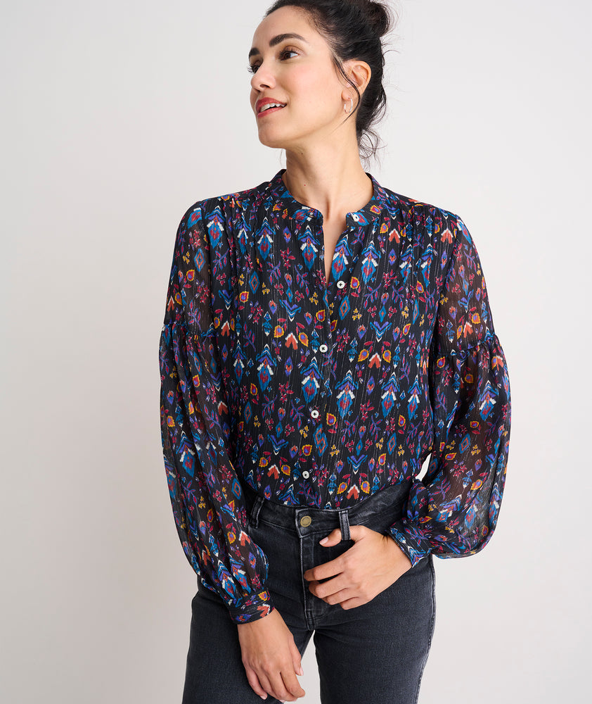 Model is wearing UNTUCKit printed black Lorelei shirt.