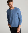 Model is wearing UNTUCKit Marastina henley in blue horizon. 