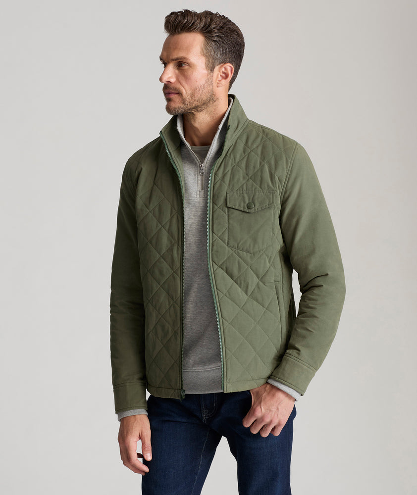 Model is wearing UNTUCKit Marty jacket in thyme.