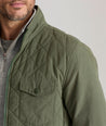 Model is wearing UNTUCKit Marty jacket in thyme.