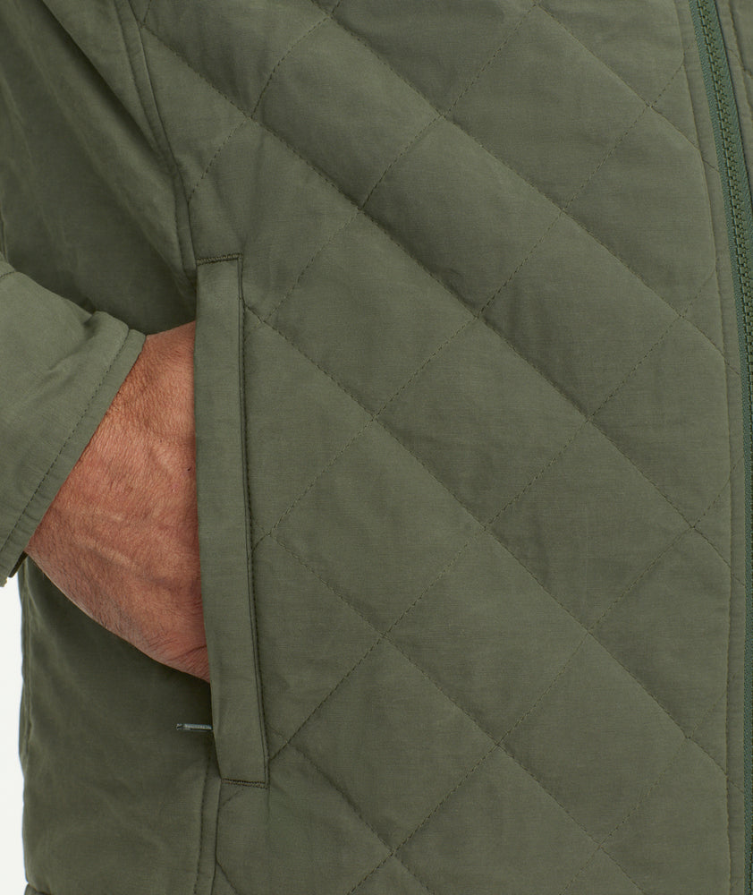 Water-repellent quilted down jacket in light wool with sailing