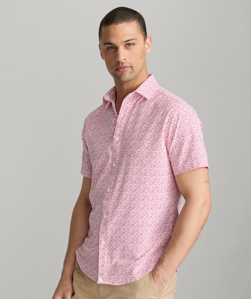 Model is wearing UNTUCKit Mavrud pink short sleeve button down.