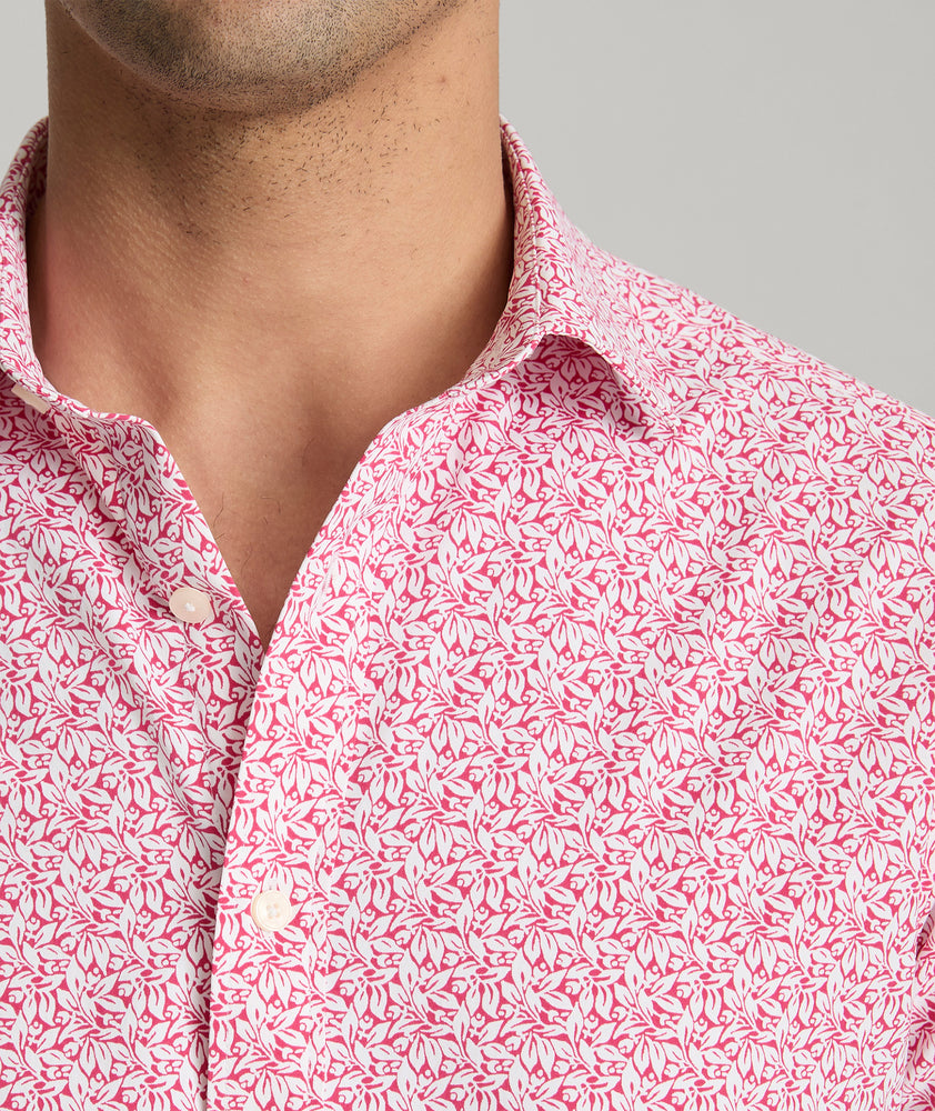 Model is wearing UNTUCKit Mavrud pink short sleeve button down.