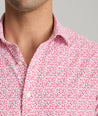 Model is wearing UNTUCKit Mavrud pink short sleeve button down.