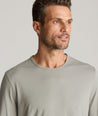 Model is wearing UNTUCKIt Merille long sleeve Tencel Tee in Military Green.