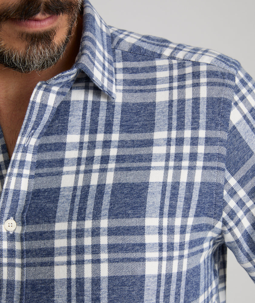 Model is wearing UNTUCKit Flannel Morenillo Shirt in Heathered Blue Plaid.