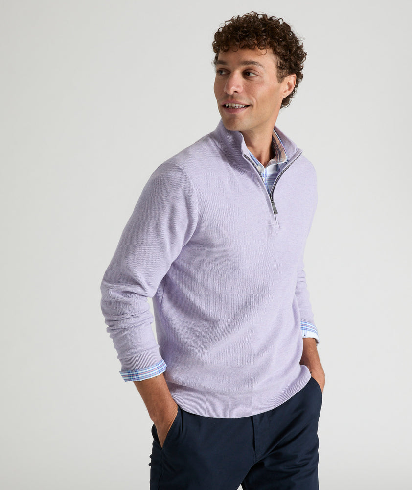 Model is wearing UNTUCKit Newbury cotton quarter zip in heather purple.