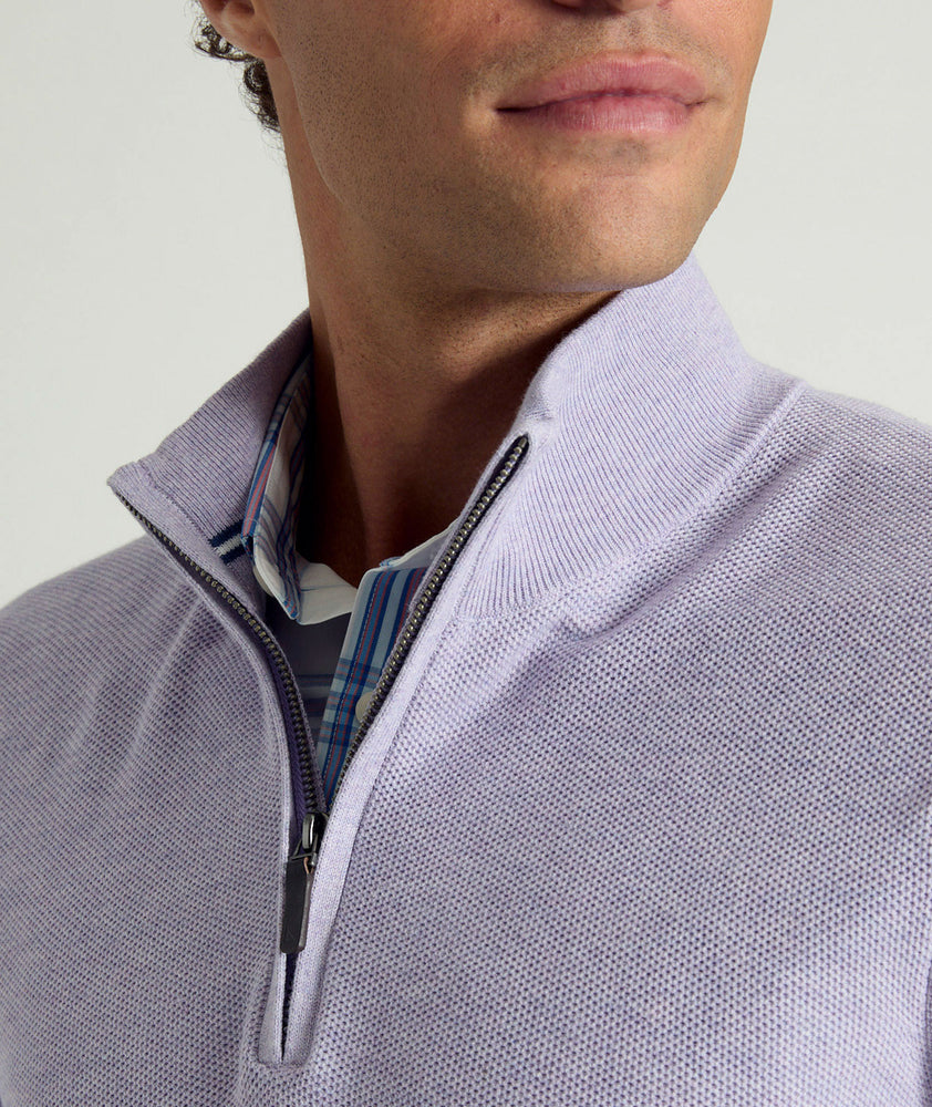 Model is wearing UNTUCKit Newbury cotton quarter zip in heather purple.