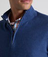 Model is wearing UNTUCKit Newbury cotton quarter zip in heather navy.