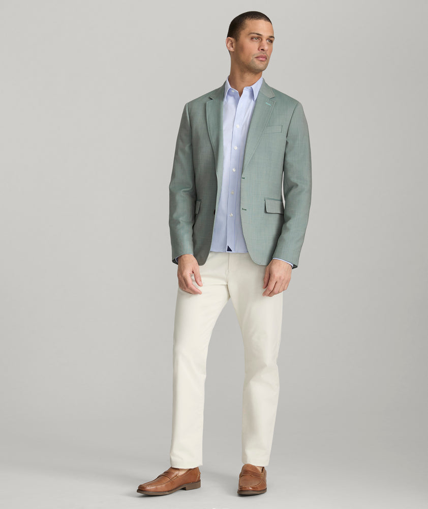 Model is wearing UNTUCKit Palazzo sport coat in green.