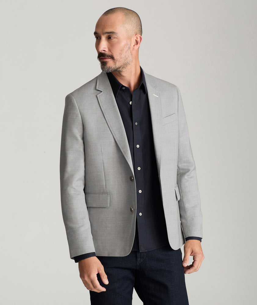 Model is wearing UNTUCKit Palazzo sport coat in gray. 