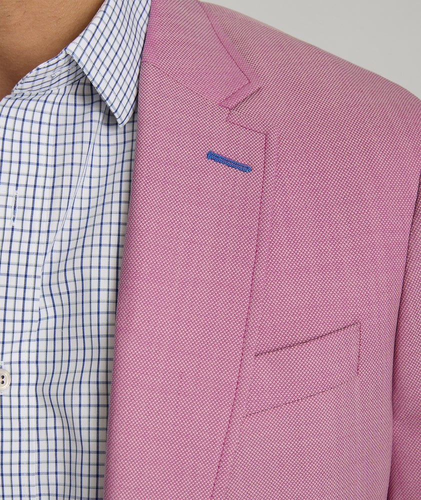 Model is wearing UNTUCKit Palazzo sport coat in pink.