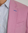 Model is wearing UNTUCKit Palazzo sport coat in pink.