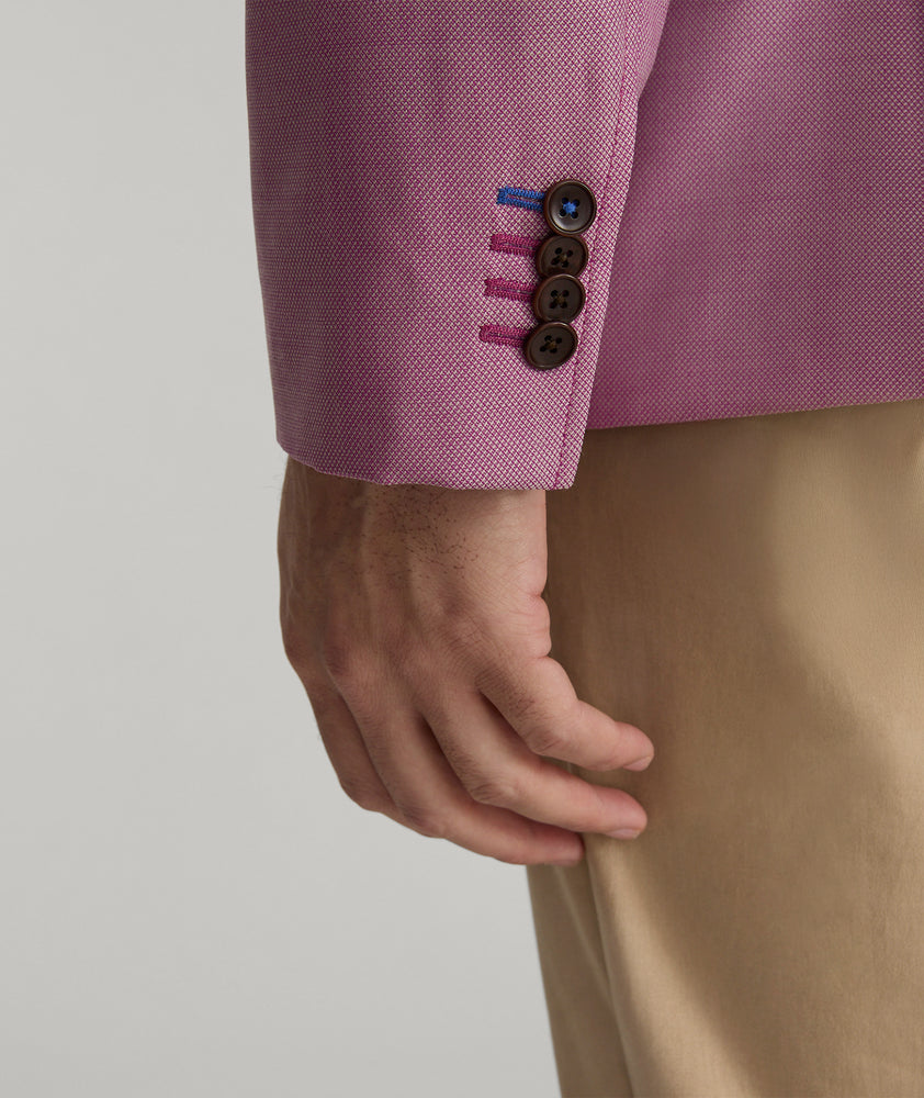 Model is wearing UNTUCKit Palazzo sport coat in pink.