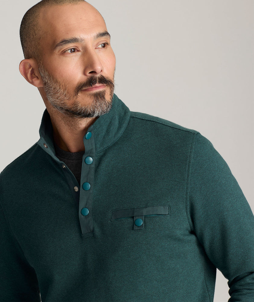 Model is wearing UNTUCKit Parkson quarter-zip in Balsam. 