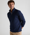 Model is wearing UNTUCKit performance sweatshirt in navy.