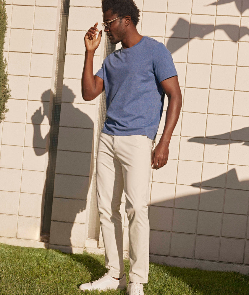 Model is wearing UNTUCKit Classic Chino Pants in Stone Gray.