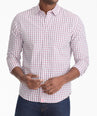 Model is wearing UNTUCKit Richardson wrinkle-free shirt in pink gingham.