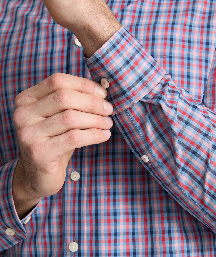 Model is wearing UNTUCKit Royston wrinkle-free shirt in red.