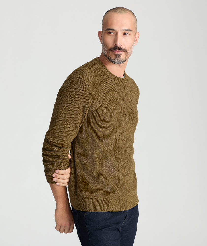 Model is wearing UNTUCKit Seaver Textured Crewneck in Dark Olive