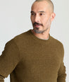 Model is wearing UNTUCKit Seaver Textured Crewneck in Dark Olive.