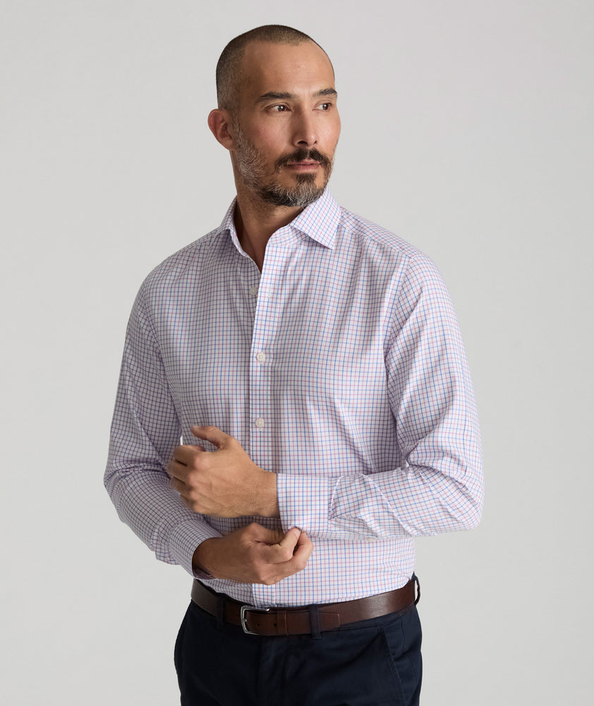 Model is wearing UNTUCKit Spencer shirt in pink. 