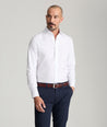 Model is wearing UNTUCKit Spencer shirt in white. 