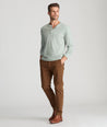 Model is wearing UNTUCKit Classic Chino Pants in brown desert palm.