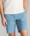 Model is wearing UNTUCKit st.vincent shorts in mid blue. 