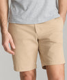 Model wearing UNTUCKit Tan 9" Chino Shorts.