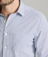 Model is wearing UNTUCKit Wrinkle-Free Performance Teramo Shirt in White & Navy Print.