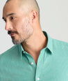 Model is wearing UNTUCKit Wrinkle-Free Veneto Shirt in bright green.