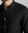 Model wearing an UNTUCKit Black Wrinkle-Resistant Linen Vin Santo Shirt