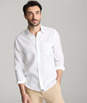 Model wearing an UNTUCKit Bright White Wrinkle-Resistant Linen Vin Santo Shirt