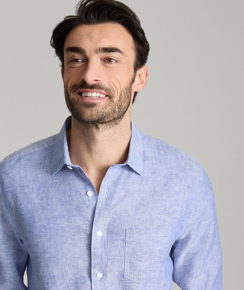 Model wearing an UNTUCKit Mid Blue Wrinkle-Resistant Linen Vin Santo Shirt