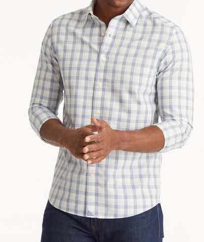 Model wearing an UNTUCKit Navy Wrinkle-Free Guilan Shirt